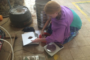 Kristin Burnham ’19 (ENG, CLAS) measures soil samples to later test the soil’s water capacity in a soil lab at Bahir Dar University. The mechanical shaker behind her is used to determine how much rock and gravel are present in the soil.