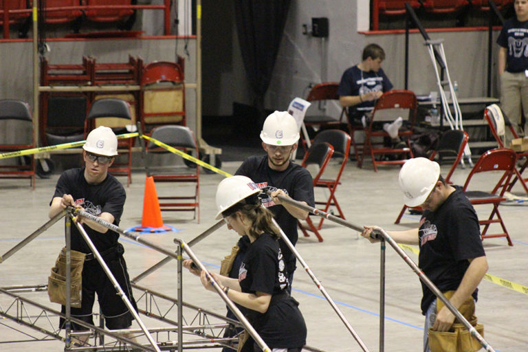 The UConn Steel bridge team assembling their bridge at the New England competition. Left to right are Kevin McMullen, Manal Tahhan, Dennis Gehring, and Richard Breitenbach. (photo courtesy of Francis McMullen)
