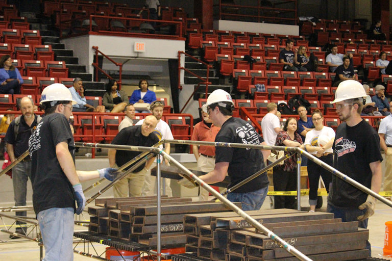 The team places 2,500 pounds on the bridge as part of the competition. From left are Richard Breitenbach, Clinit Cornacchia, and Dennis Gehring. (Photo courtesy of Francis McMullen)