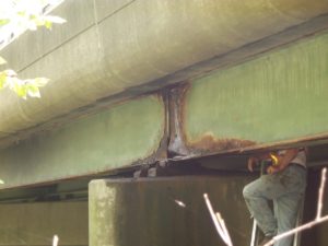 A bridge in Massachusetts, showing corrosion of a steel beam. (Photo courtesy of CME Engineering)
