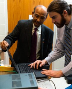 Two Applied Mechanics engineers working together on a laptop 