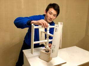 Photo of Brodey Lu with his wind turbine project.