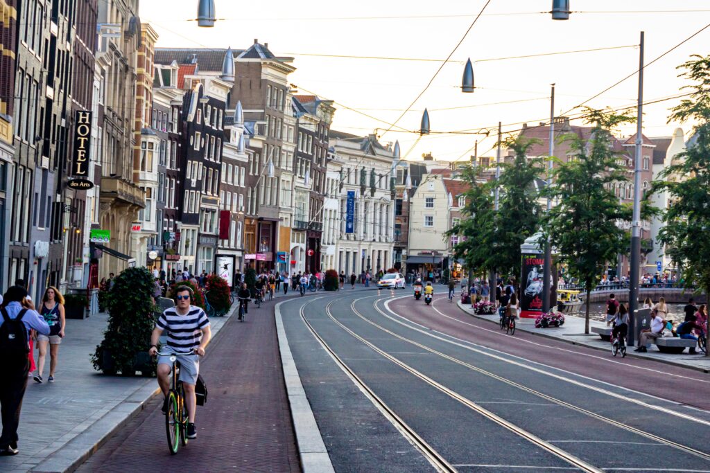 Man biking in a bustling city