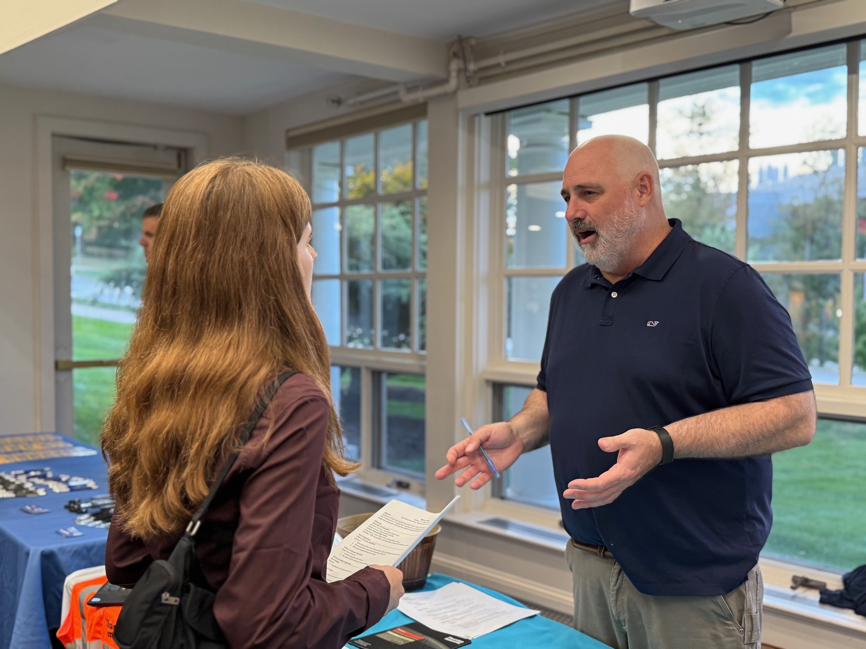 male employer discussing career possibilities with female student